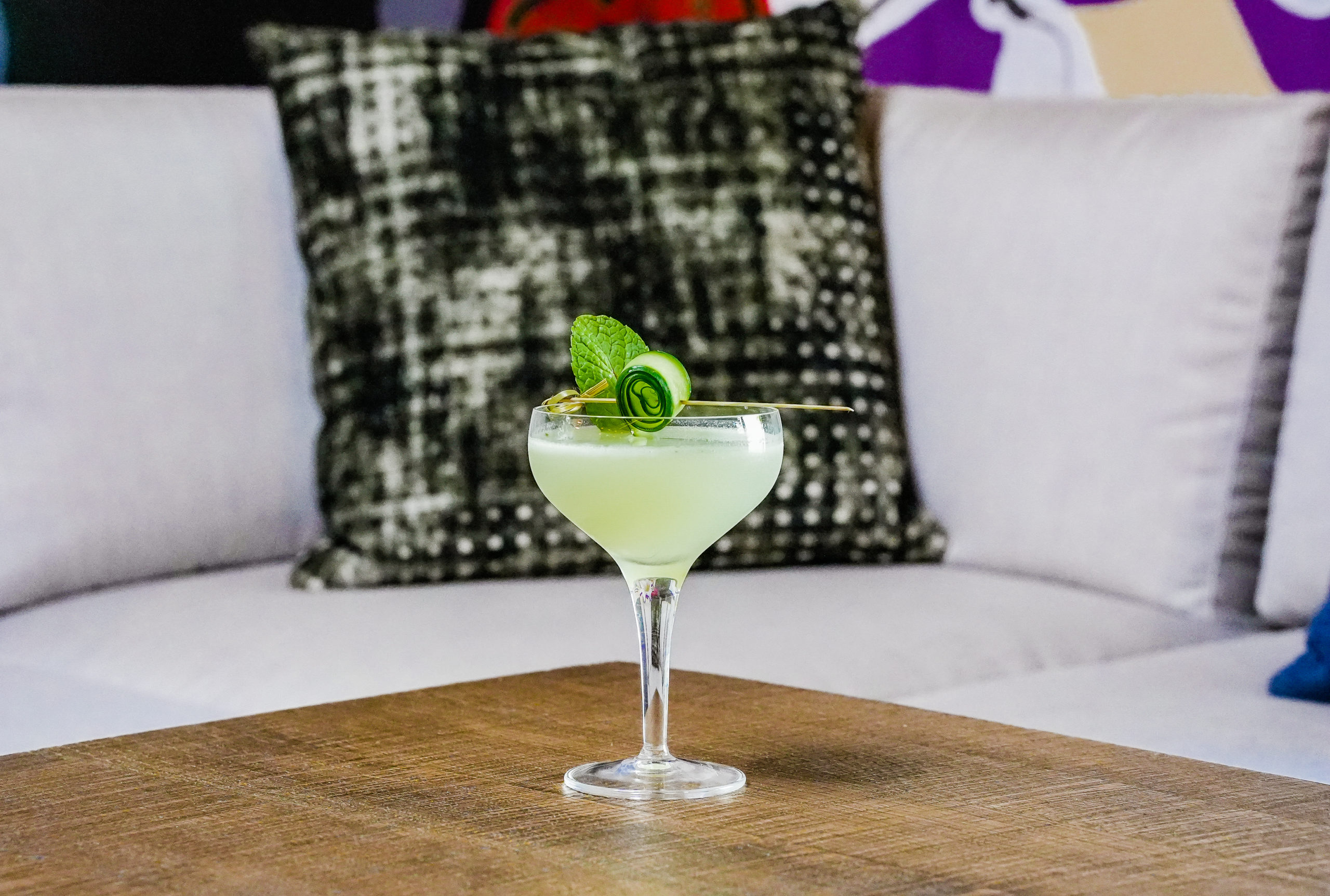 a glass of cocktail on the table